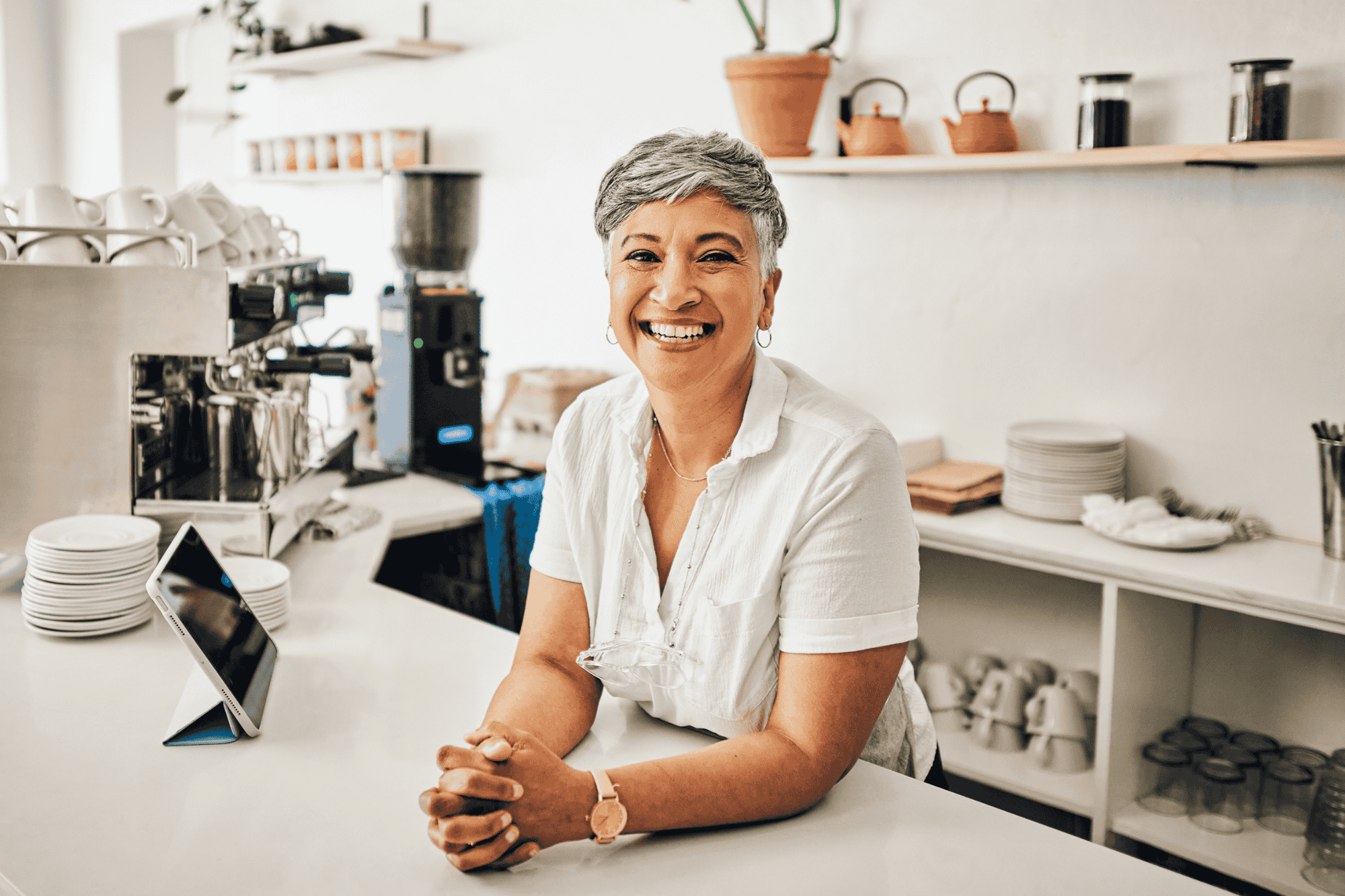 woman at front counter in cafe