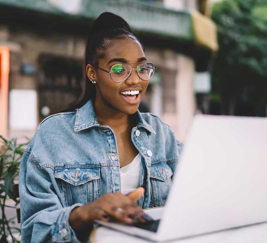 Woman applying for a balance transfer with a VISA credit card from Red Canoe