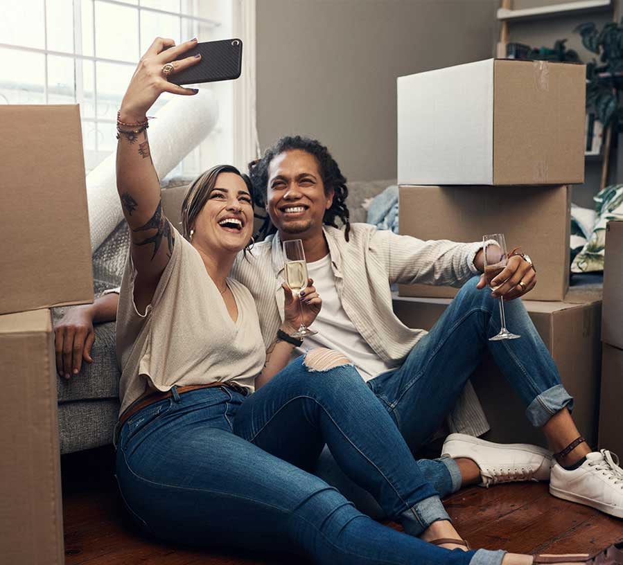Couple moving into new home mortgaged with Red Canoe