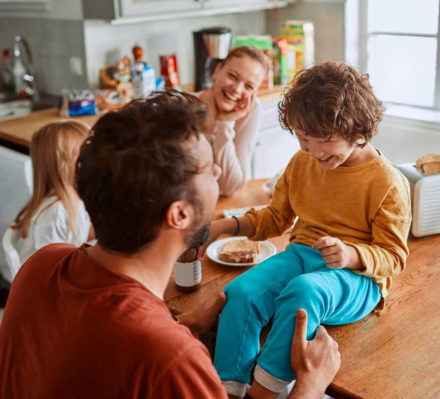 Family with a Red Canoe Savings account eating lunch at home