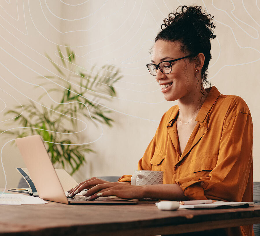 Woman on laptop contacting Red Canoe Credit Union