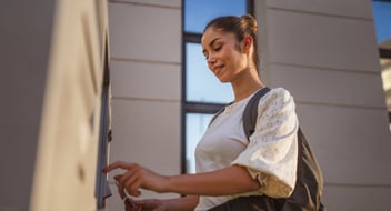 woman using co-op atm