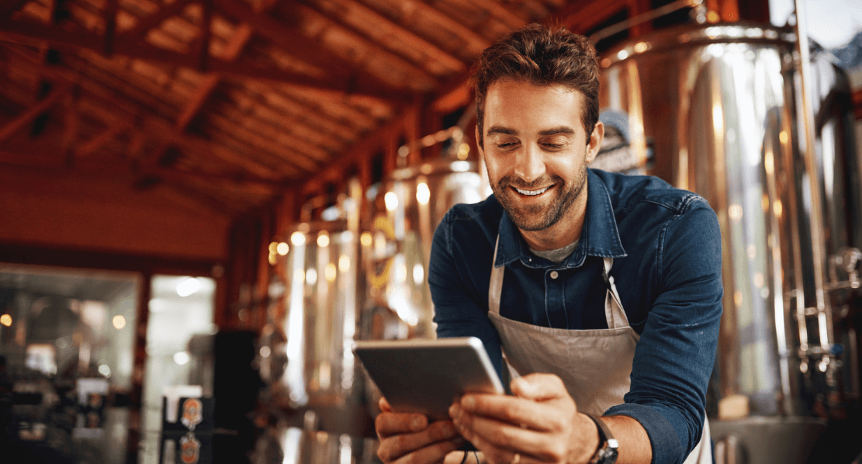 man using his Business Credit Card at his brewery 
