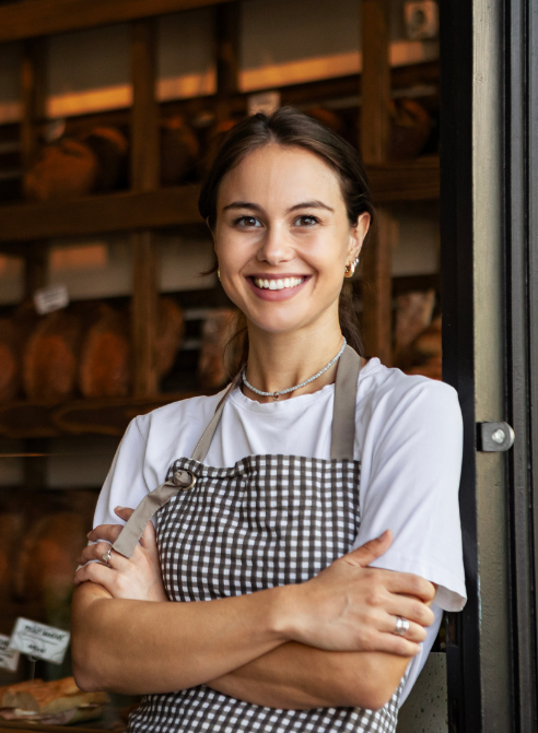 smiling woman in her cafe