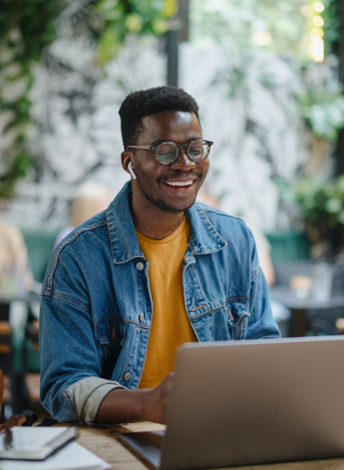 man looking at his laptop